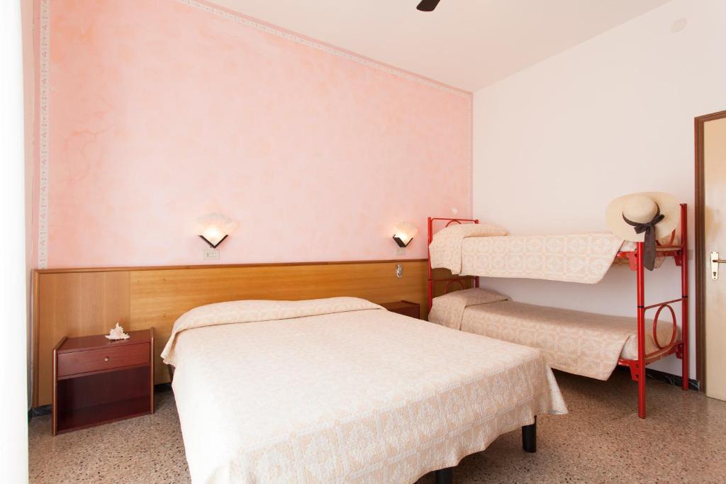 Postel nebo postele na pokoji v ubytování Hotel Arborea