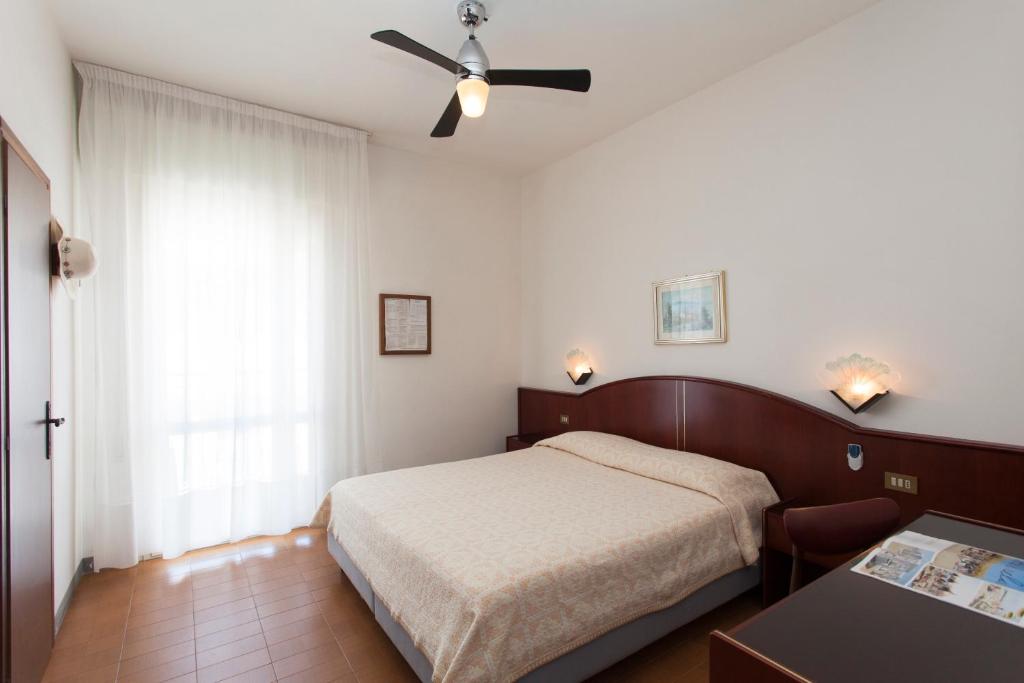 Postel nebo postele na pokoji v ubytování Hotel Arborea