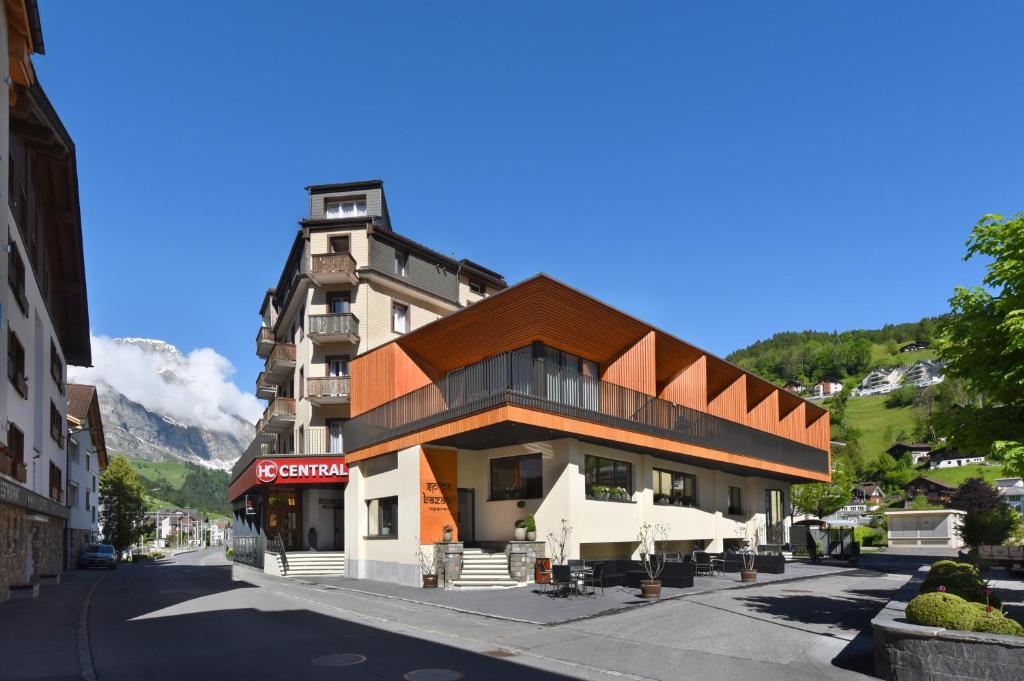 a building on the side of a street at Hotel Central in Engelberg