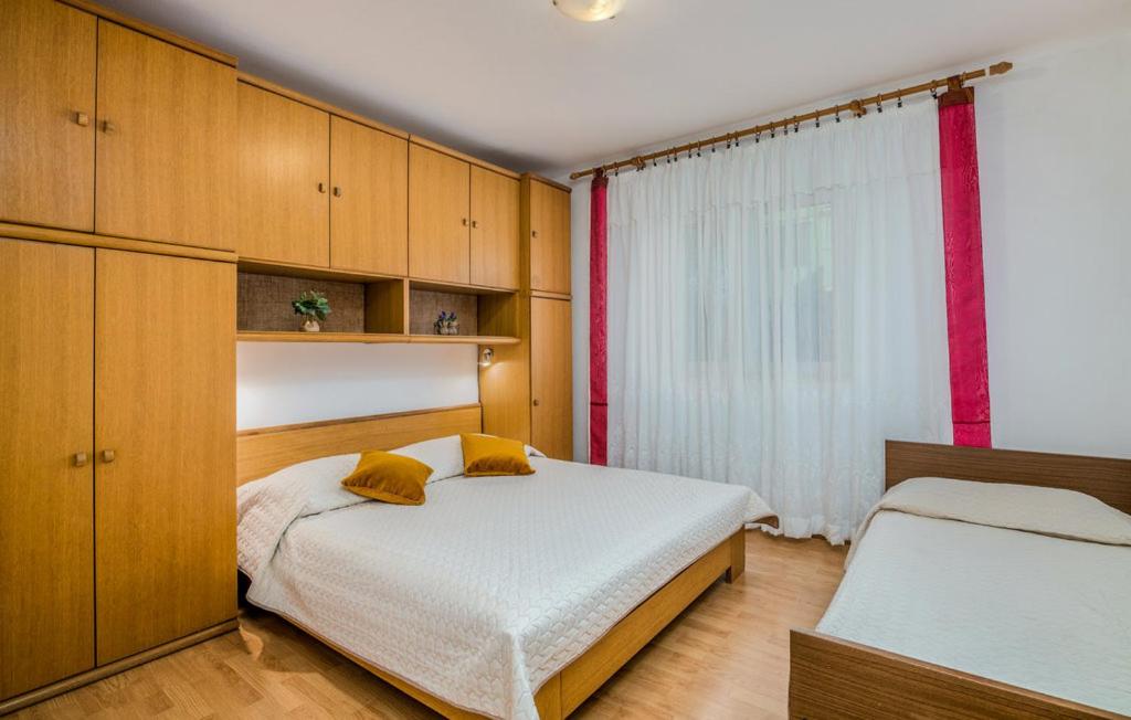 Voodi või voodid majutusasutuse Guesthouse Villa Marija toas