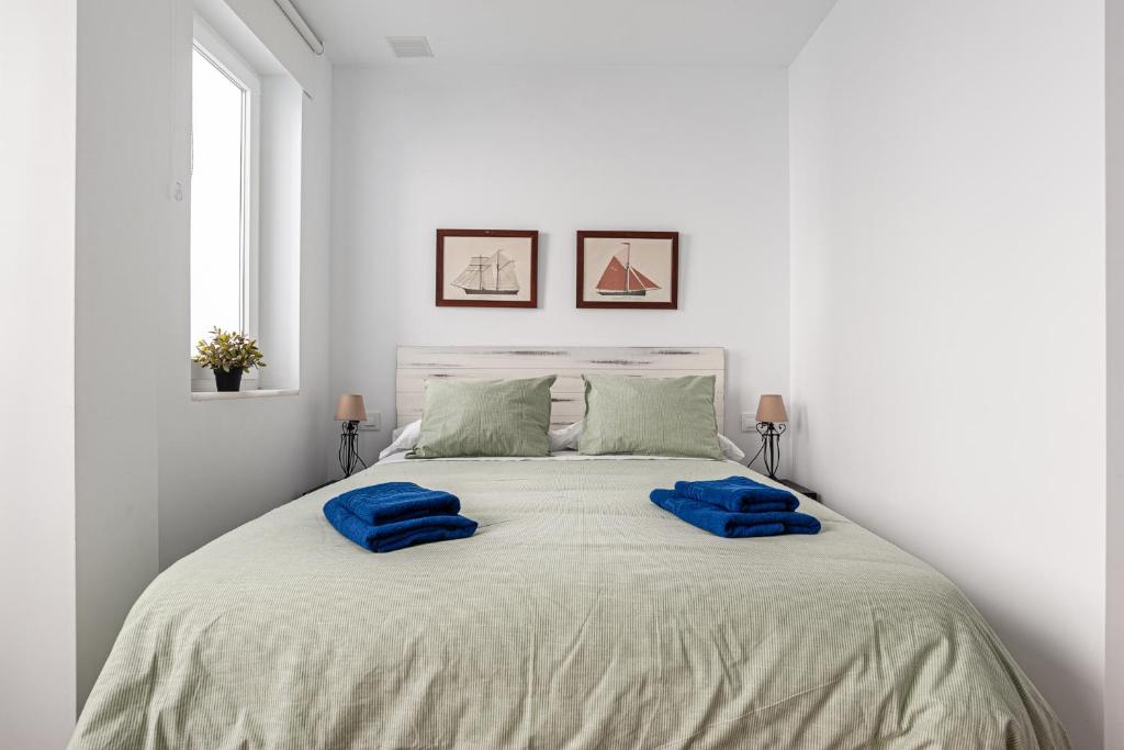 Posteľ alebo postele v izbe v ubytovaní Apartamentos Wamba