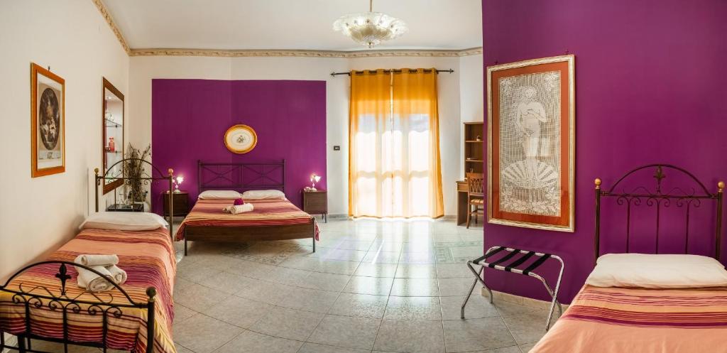 Postel nebo postele na pokoji v ubytování Villa Concordia