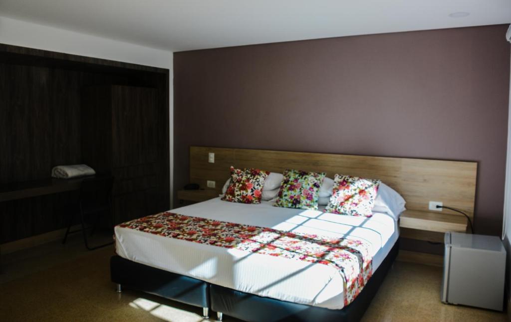 Postel nebo postele na pokoji v ubytování Hotel Poma Rosa