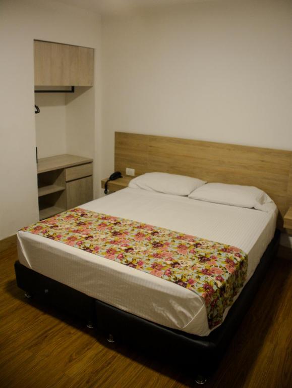Postel nebo postele na pokoji v ubytování Hotel Poma Rosa
