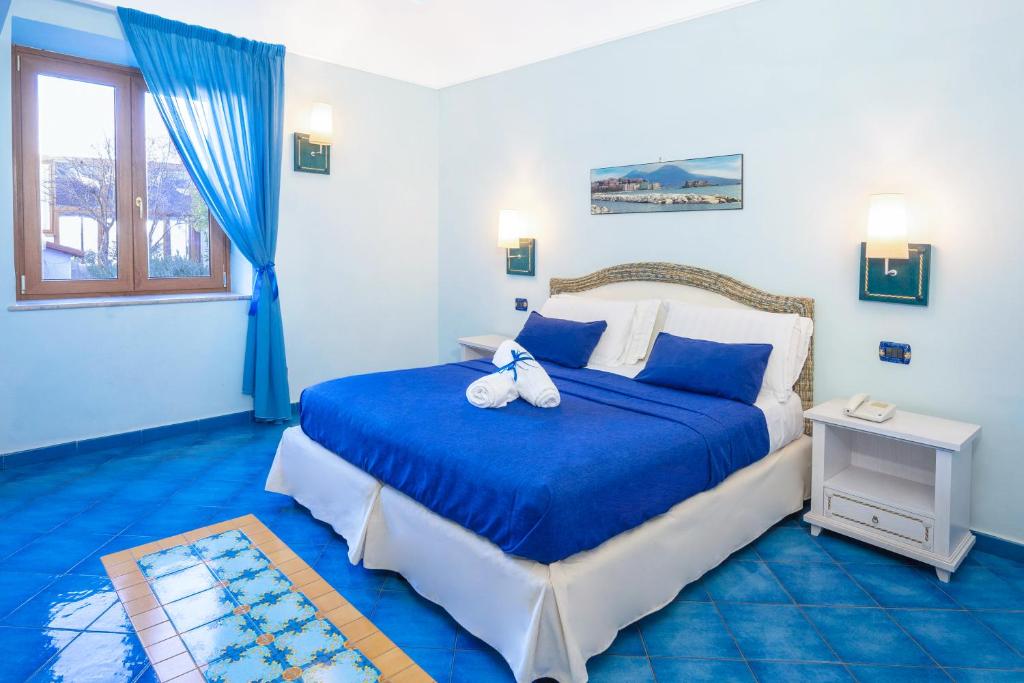 Łóżko lub łóżka w pokoju w obiekcie Hotel Myage