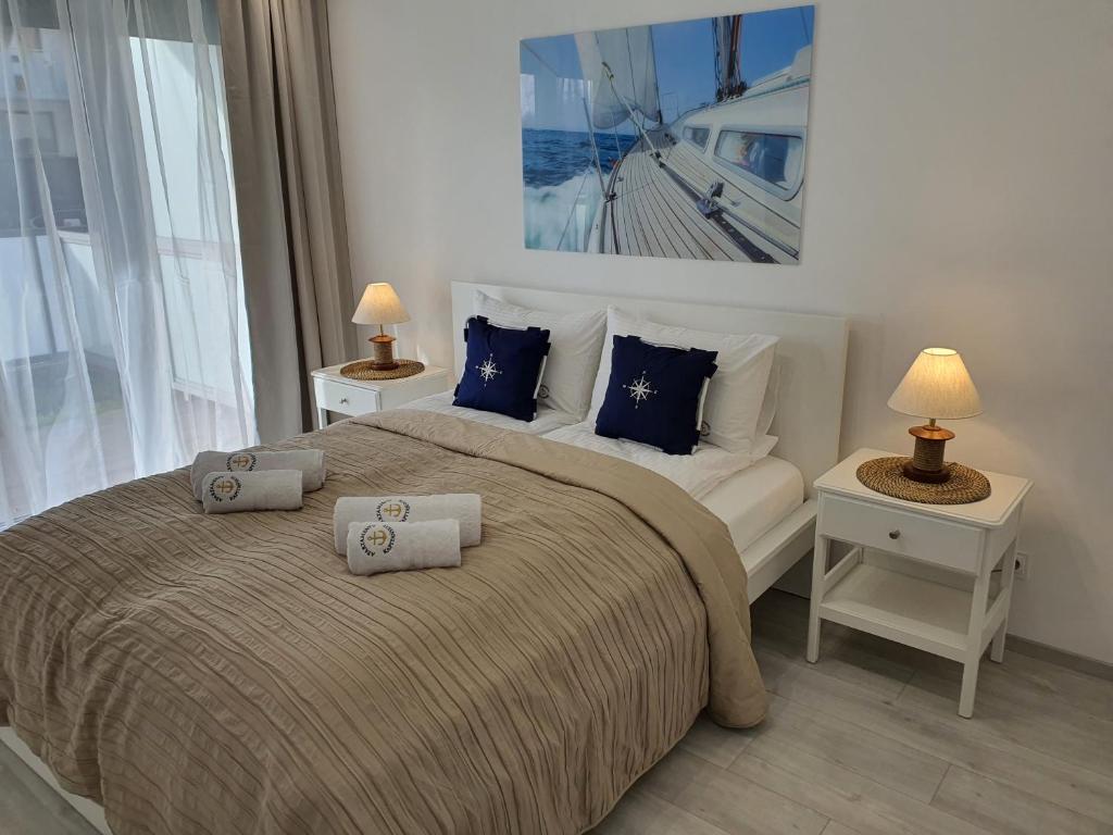 Posteľ alebo postele v izbe v ubytovaní Apartamenty Kapitańskie Kasprowicza 20A taras