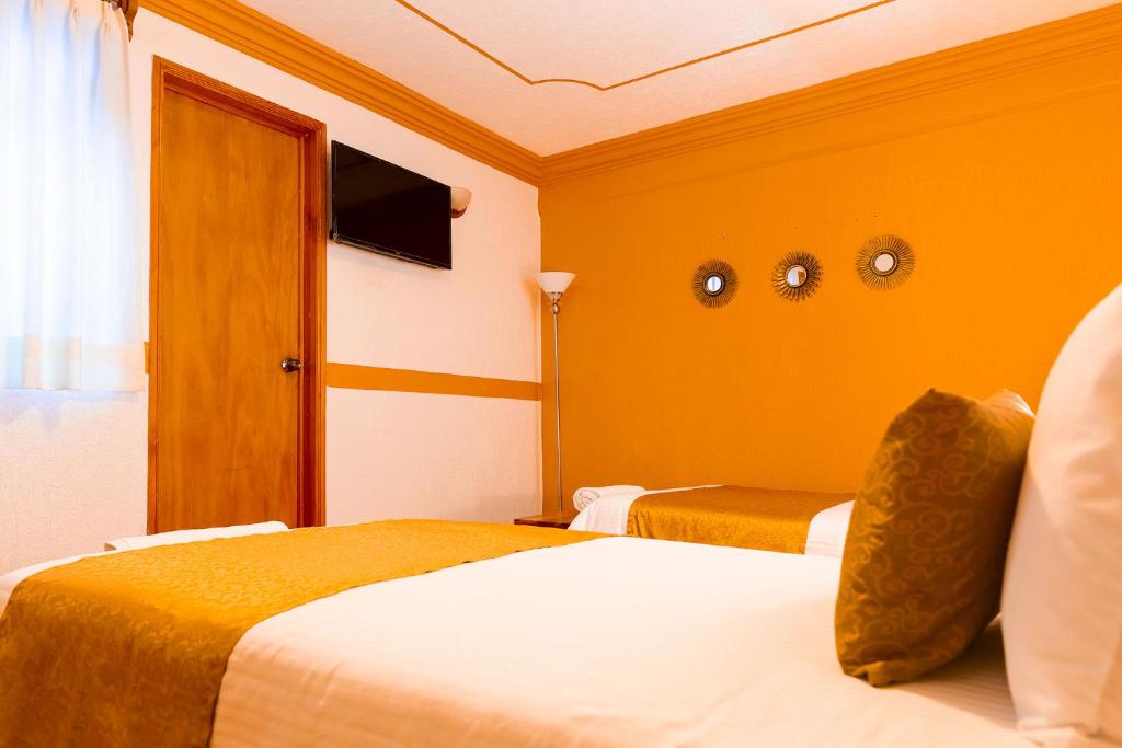Postel nebo postele na pokoji v ubytování Casablanca Hotel Tula