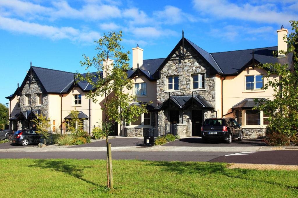 a large house with a car parked in front of it at Ardmullen in Kenmare