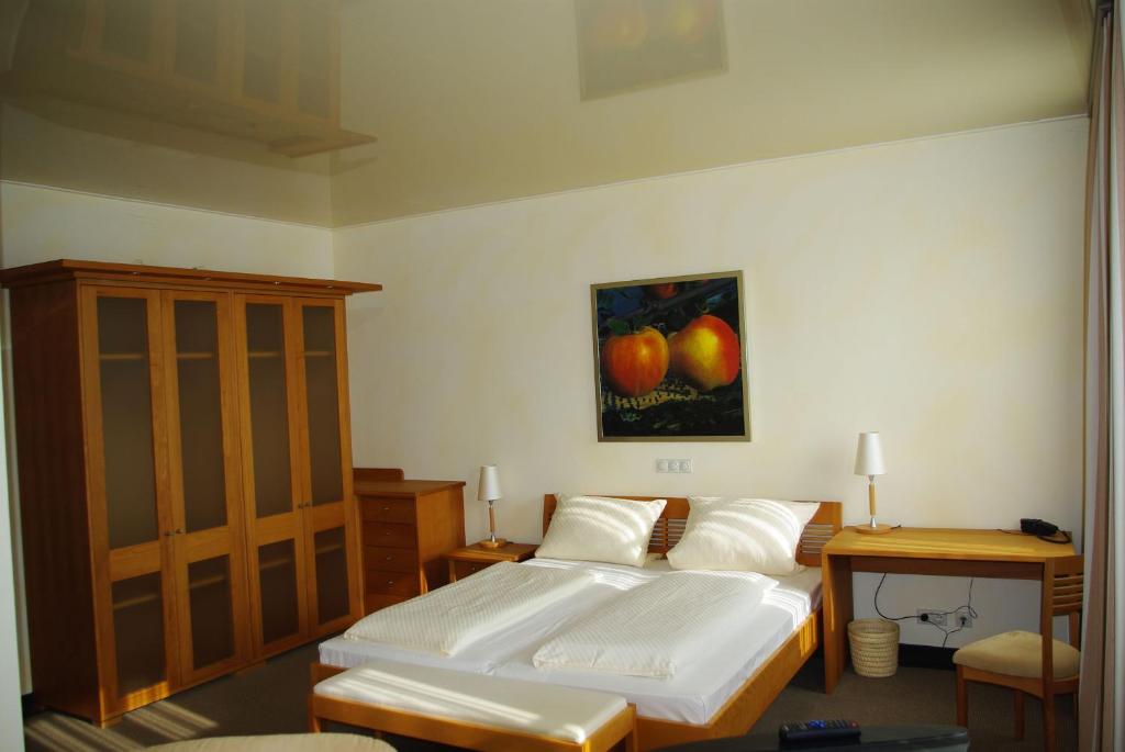 Postel nebo postele na pokoji v ubytování Staffelsteiner Hof