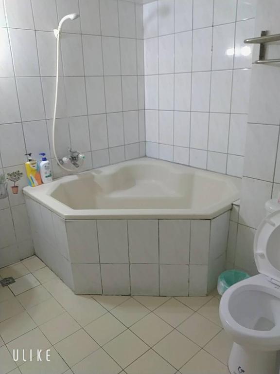 Koupelna v ubytování Zhiben hotspring Heping Guesthouse