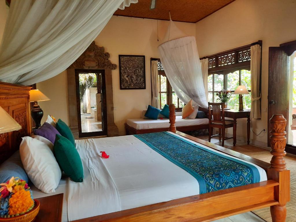 Postel nebo postele na pokoji v ubytování Alam Jiwa Ubud