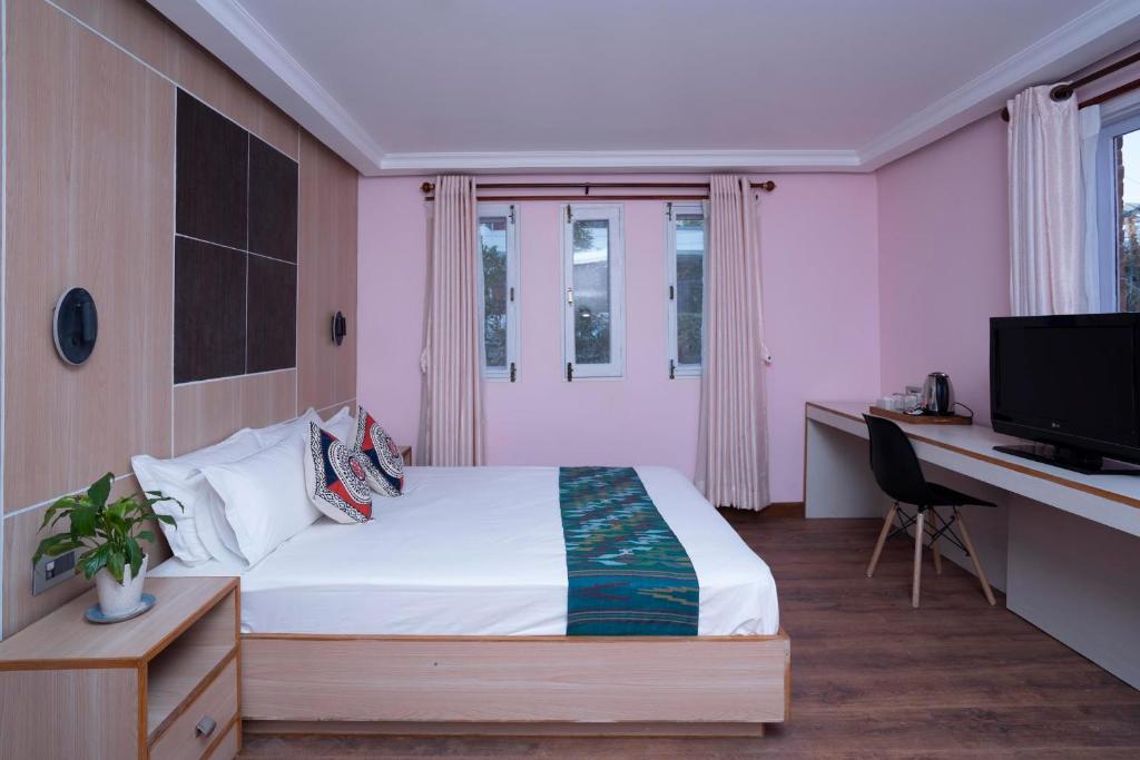 Postel nebo postele na pokoji v ubytování Stilly Inn