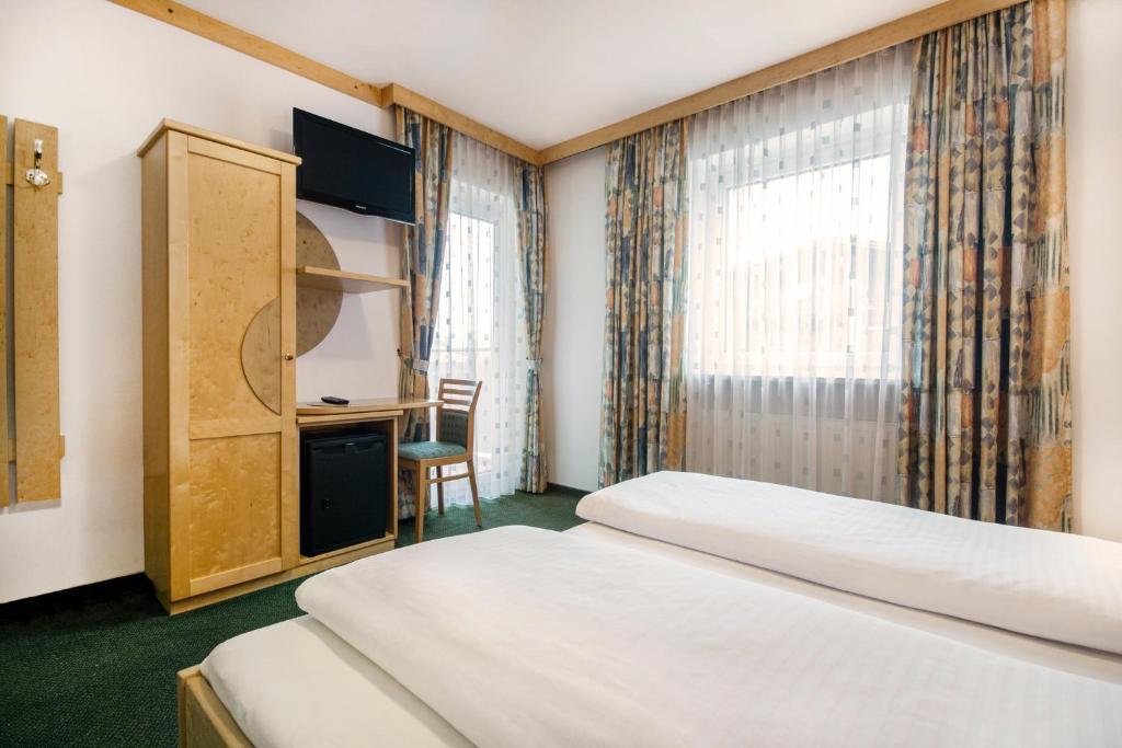 Postel nebo postele na pokoji v ubytování Apartpension Kappacher