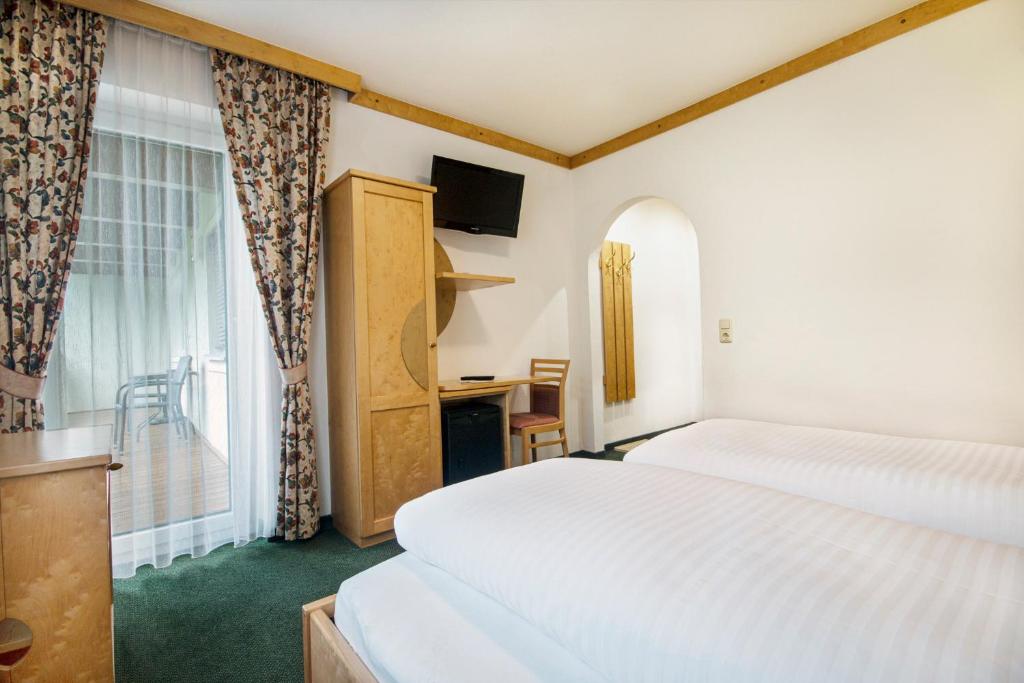 Postel nebo postele na pokoji v ubytování Apartpension Kappacher