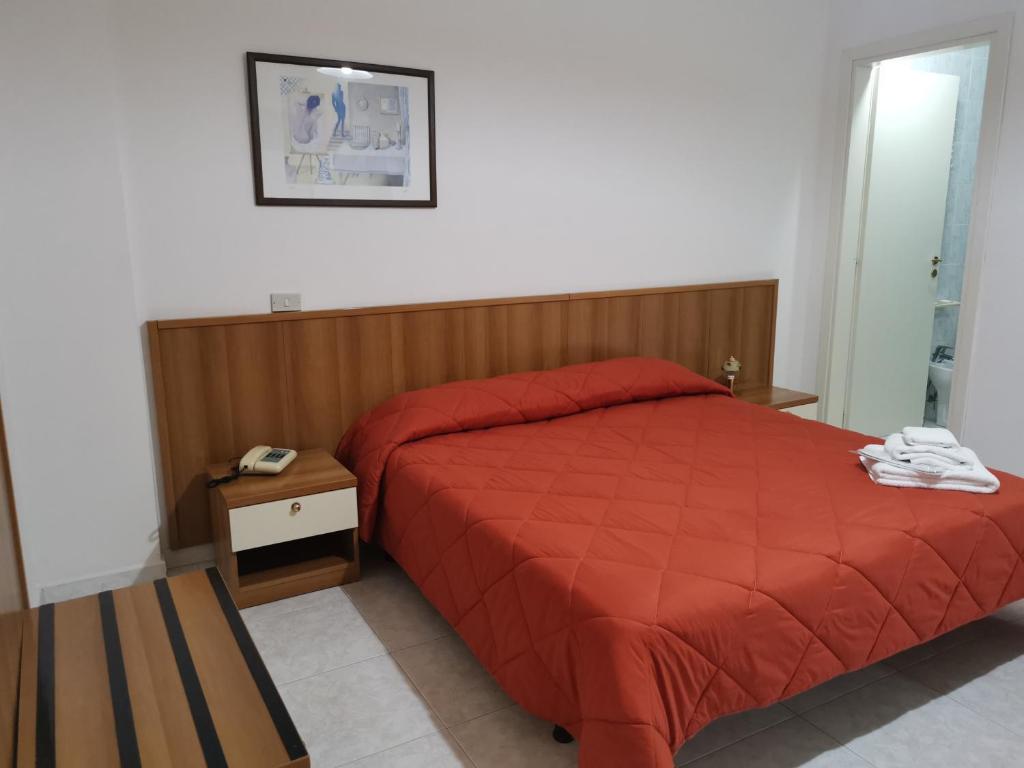Кровать или кровати в номере Hotel Park Grumentum