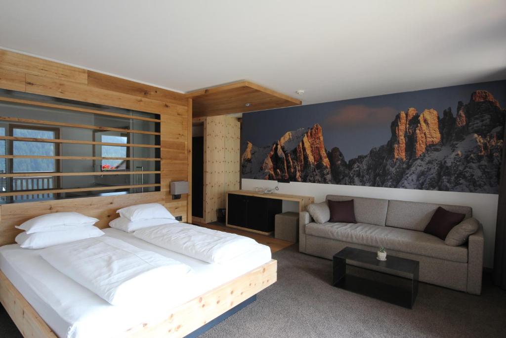 Postel nebo postele na pokoji v ubytování Charme Hotel Friedrich