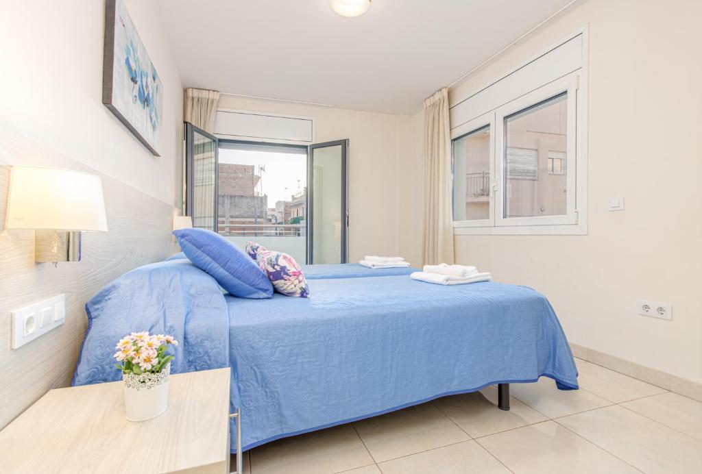 Posteľ alebo postele v izbe v ubytovaní Apart-rent Apartamento Francesc Macia 2003