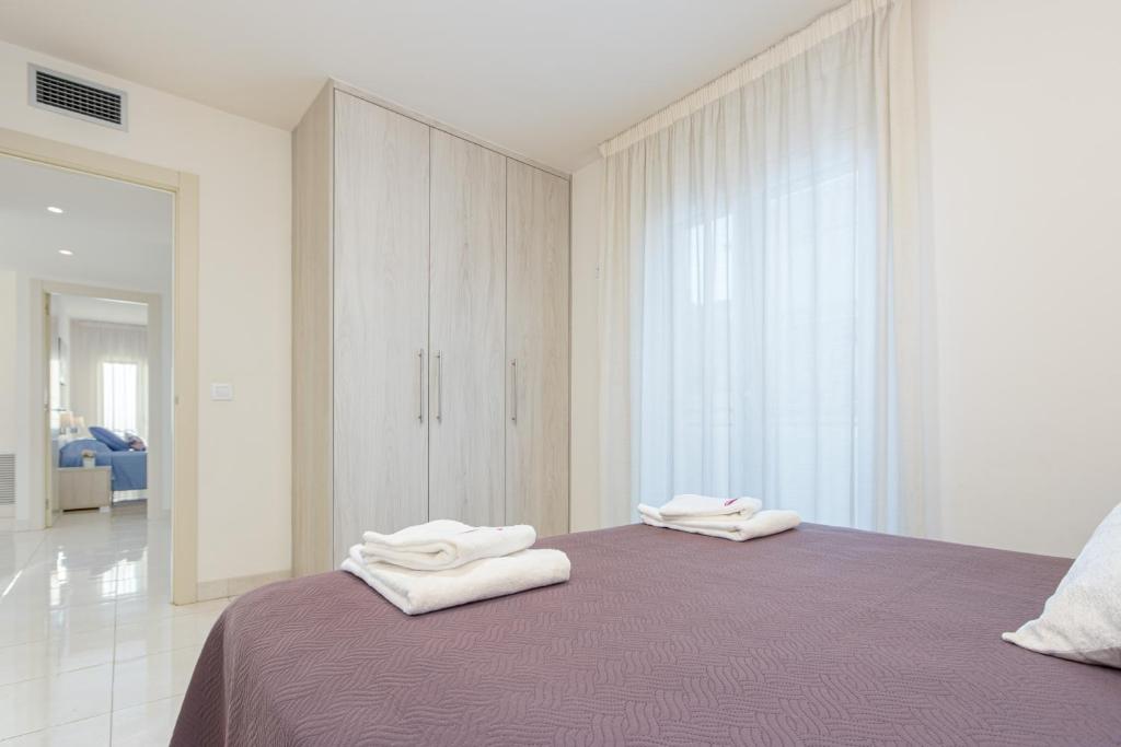 Posteľ alebo postele v izbe v ubytovaní Apart-rent Apartamento Francesc Macia 2003