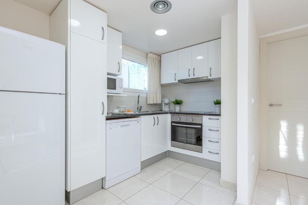 Kuchyňa alebo kuchynka v ubytovaní Apart-rent Apartamento Francesc Macia 2003