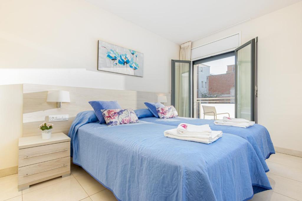 Posteľ alebo postele v izbe v ubytovaní Apart-rent Apartamento Francesc Macia 2003