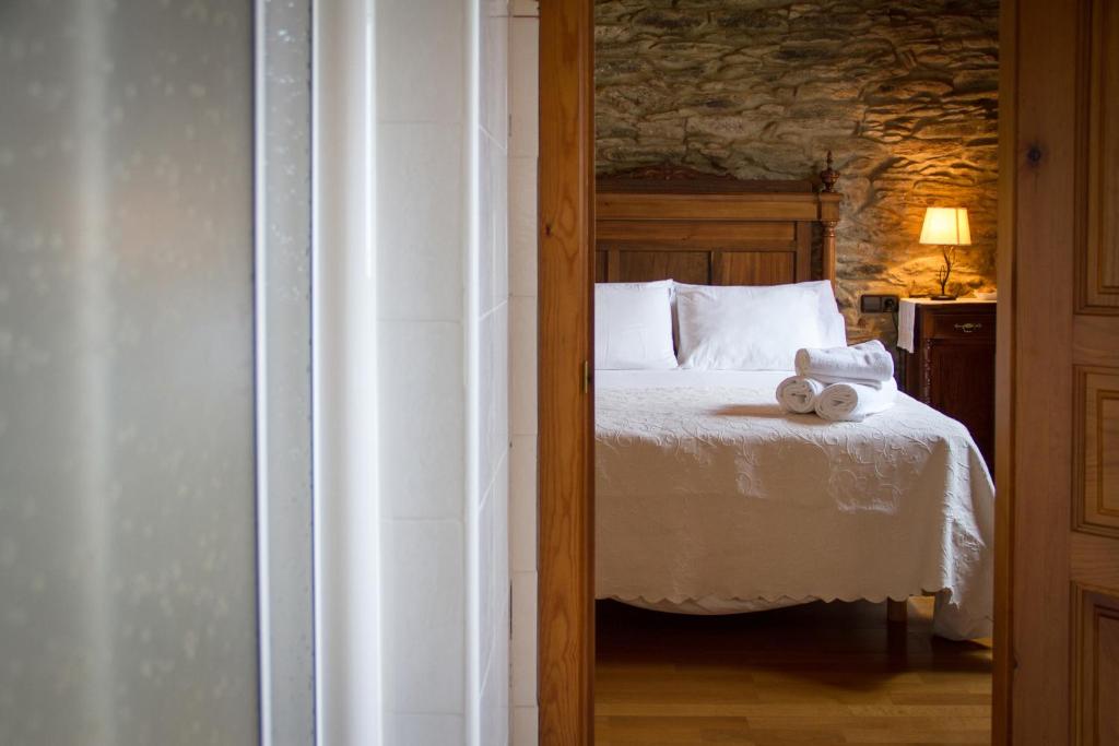 Łóżko lub łóżka w pokoju w obiekcie Casa Rural Penaquente
