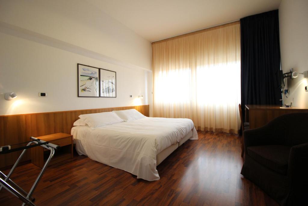 Postel nebo postele na pokoji v ubytování Hotel Majesty Bari