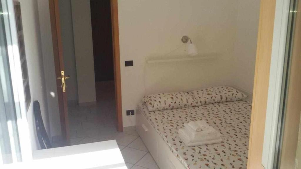 Łóżko lub łóżka w pokoju w obiekcie La casetta di Sofia