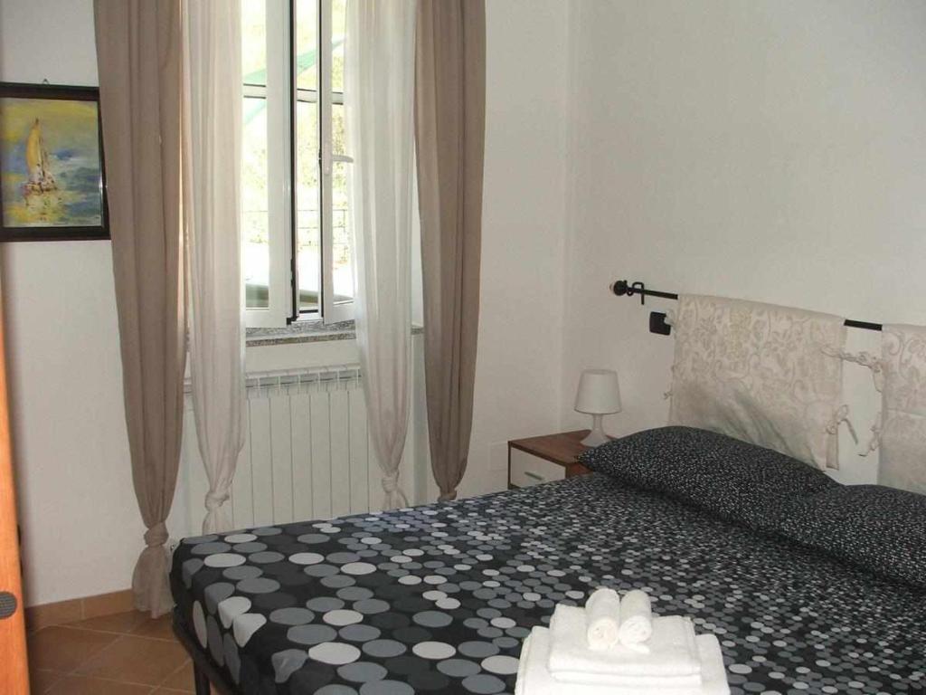 Łóżko lub łóżka w pokoju w obiekcie La casetta di Sofia