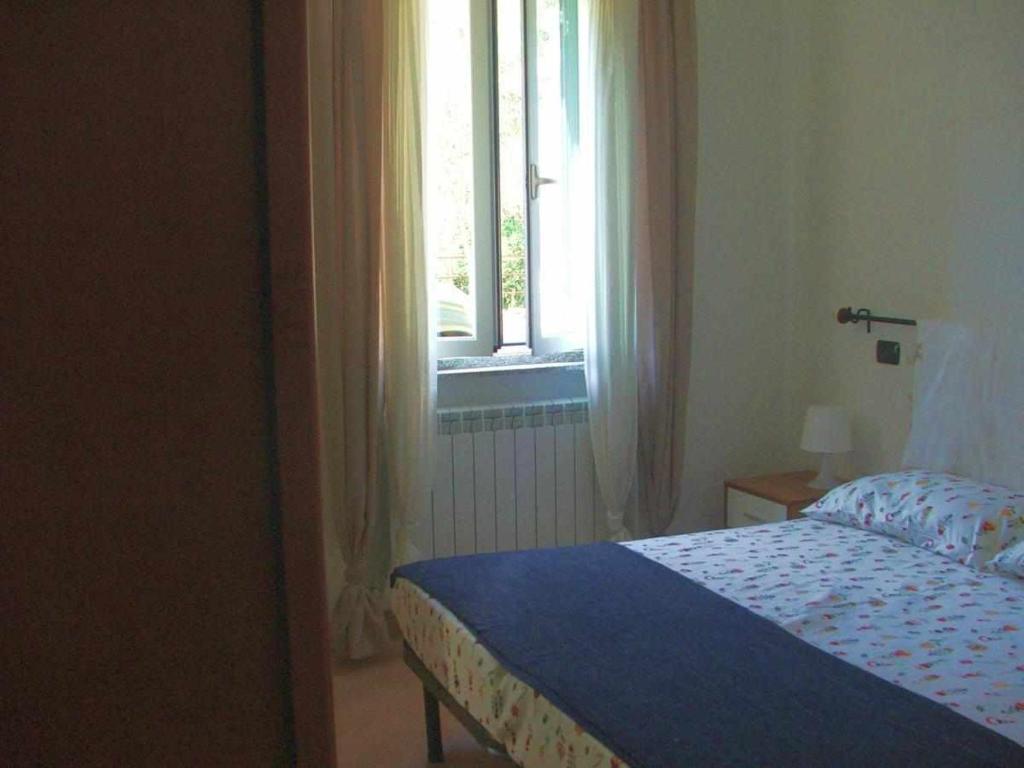 Łóżko lub łóżka w pokoju w obiekcie La casetta di Sofia