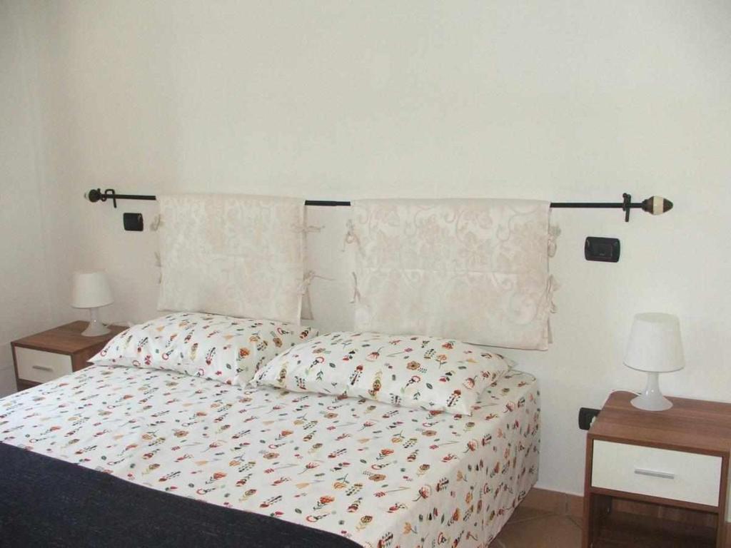 Łóżko lub łóżka w pokoju w obiekcie La casetta di Sofia