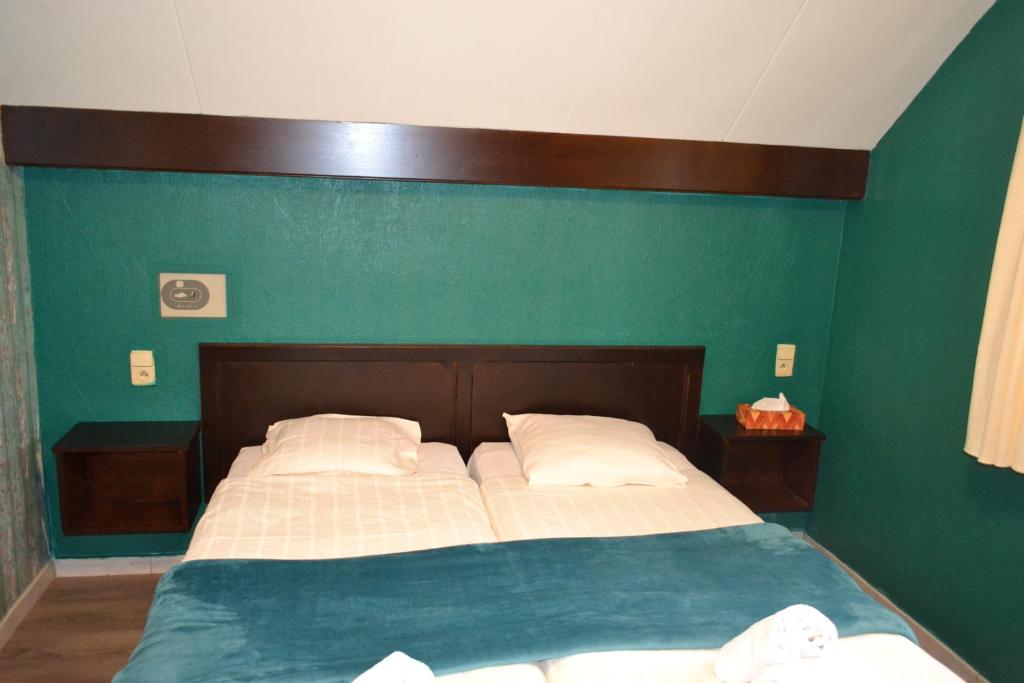 Postel nebo postele na pokoji v ubytování Hotel Plaza