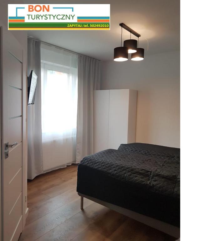 Ein Bett oder Betten in einem Zimmer der Unterkunft Pensjonat Orle Gniazdo