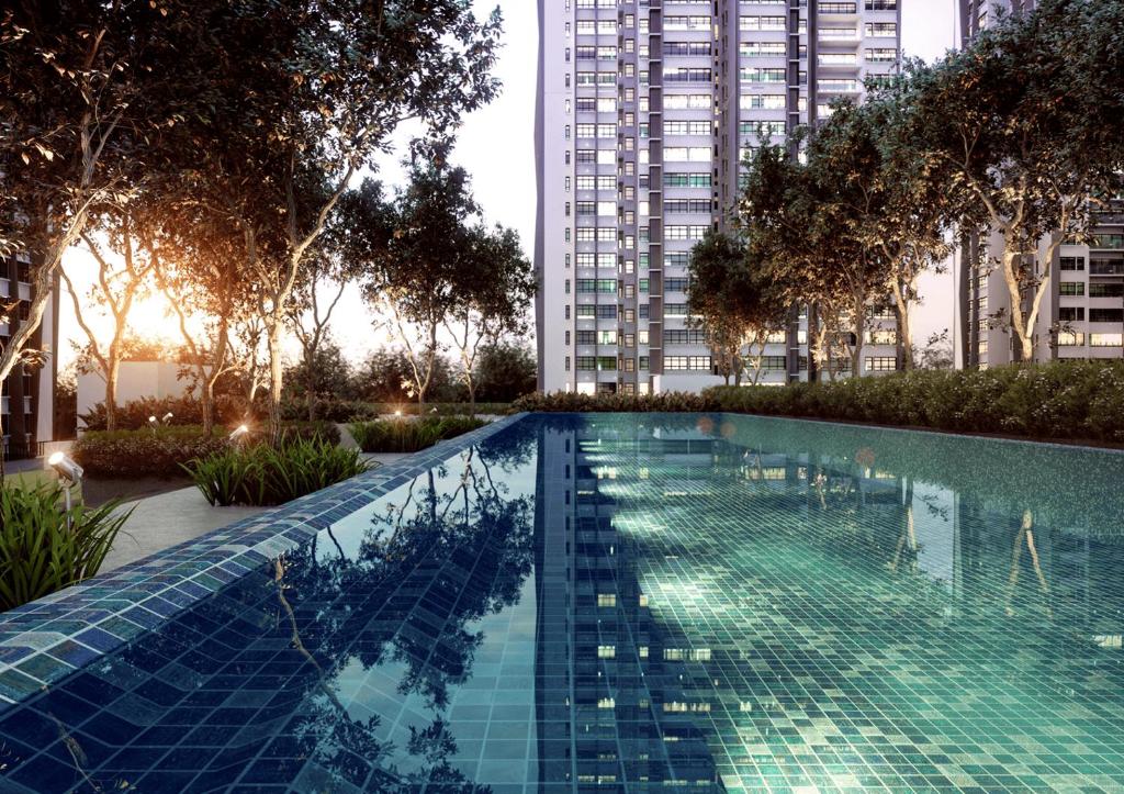 a swimming pool in a city with tall buildings at The Lake-ville KL Jalan Kuching by M Platinum in Kuala Lumpur