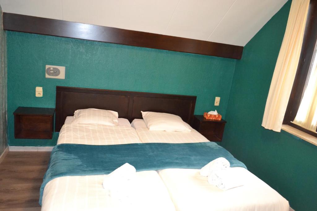 Postel nebo postele na pokoji v ubytování Hotel Plaza