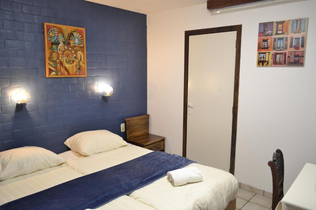 Postel nebo postele na pokoji v ubytování Hotel Plaza
