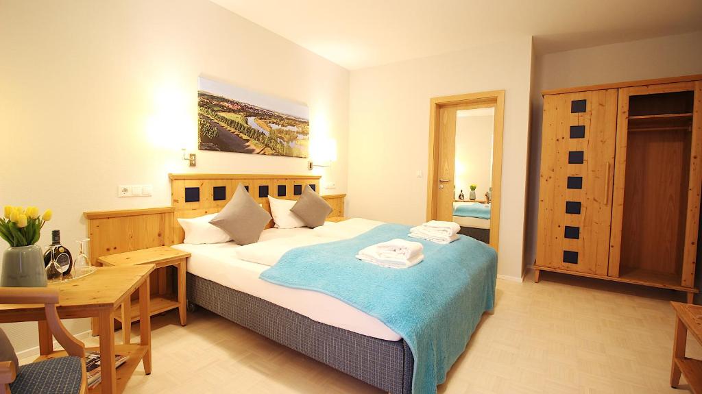 Postel nebo postele na pokoji v ubytování Aparthotel Alte Schmiede Dettelbach