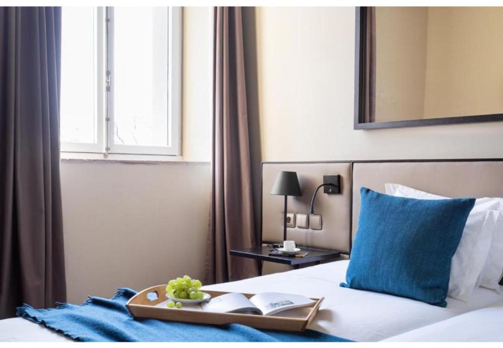 Postel nebo postele na pokoji v ubytování JOIVY Downtown Market Apartments