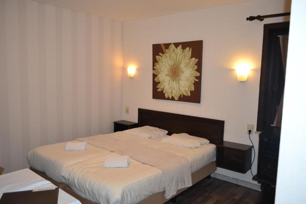 Postel nebo postele na pokoji v ubytování Hotel Plaza
