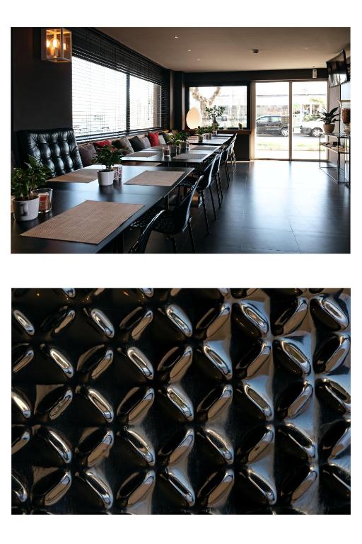 a restaurant with a bunch of tables and chairs at Hotel Salus in Pescara