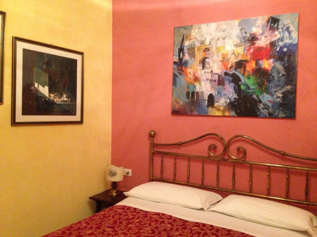Postel nebo postele na pokoji v ubytování Hotel Morlacchi