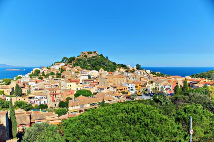 a town on top of a hill with the ocean at B-5 BEGUR 4 PaX in Begur