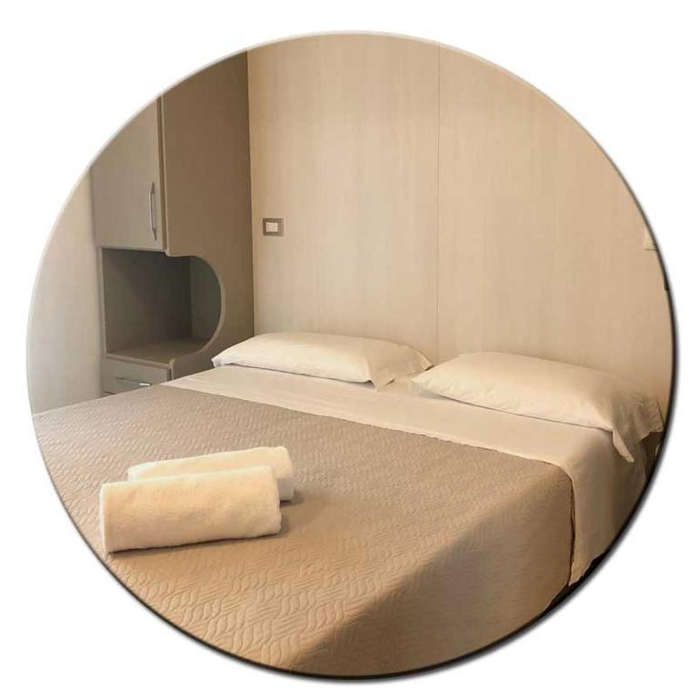 Posteľ alebo postele v izbe v ubytovaní Hotel Amedea