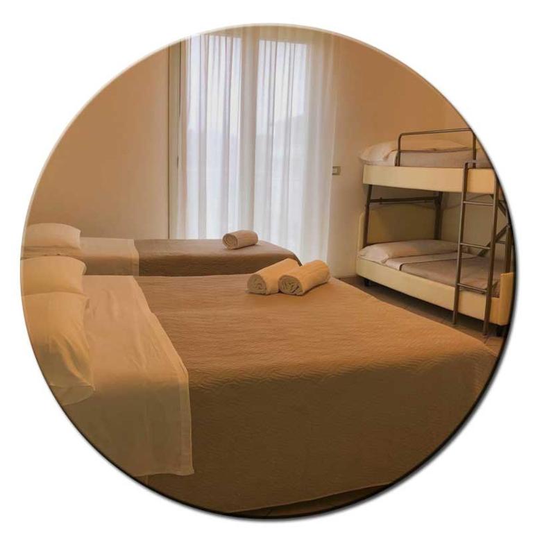 Posteľ alebo postele v izbe v ubytovaní Hotel Amedea