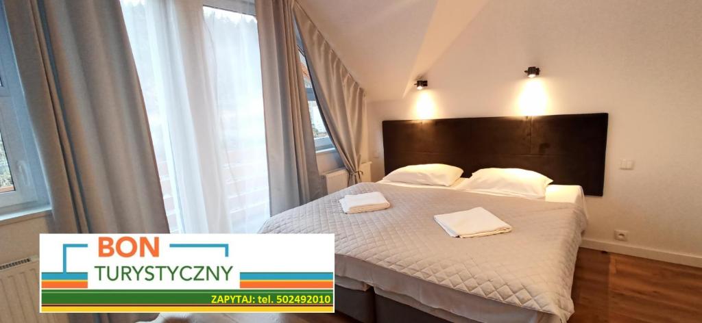 Ein Bett oder Betten in einem Zimmer der Unterkunft Pensjonat Orle Gniazdo