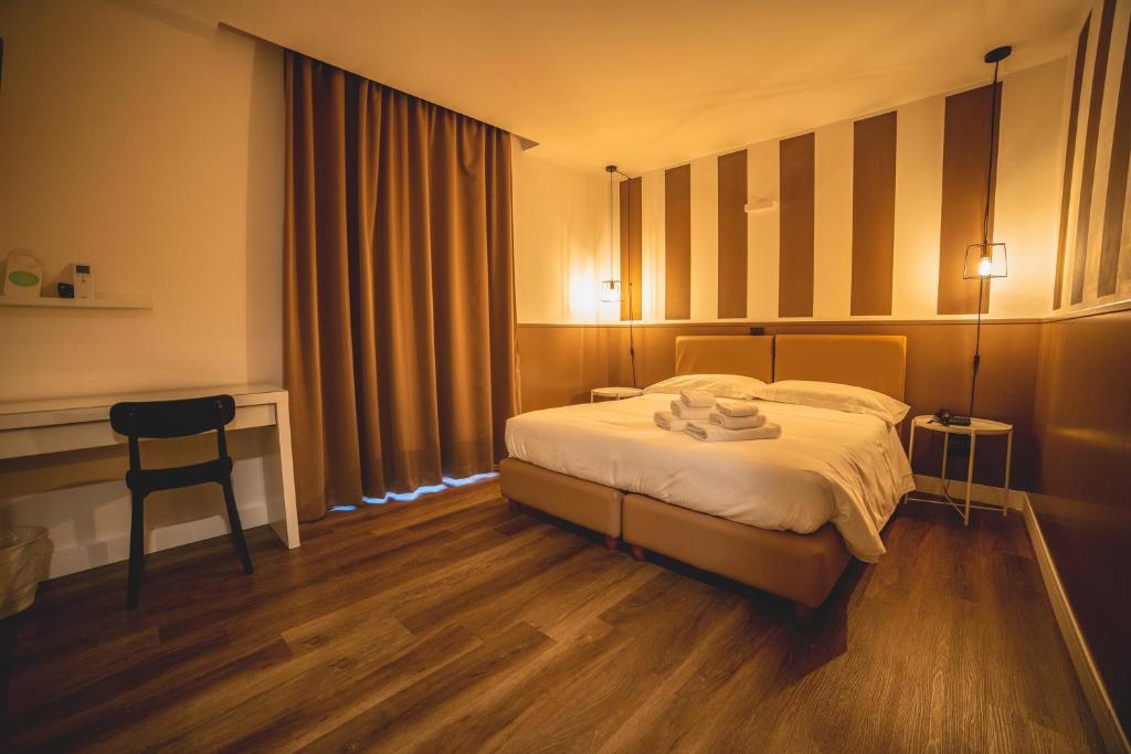 Tempat tidur dalam kamar di Hotel Continental