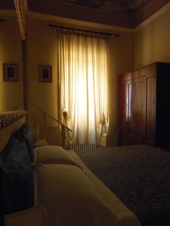 Postel nebo postele na pokoji v ubytování Hotel Morlacchi