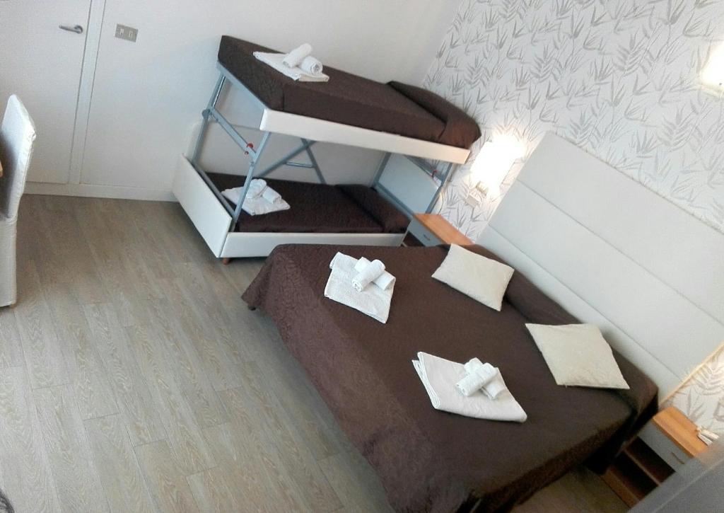 Postel nebo postele na pokoji v ubytování Hotel Ermeti B&B Brunch