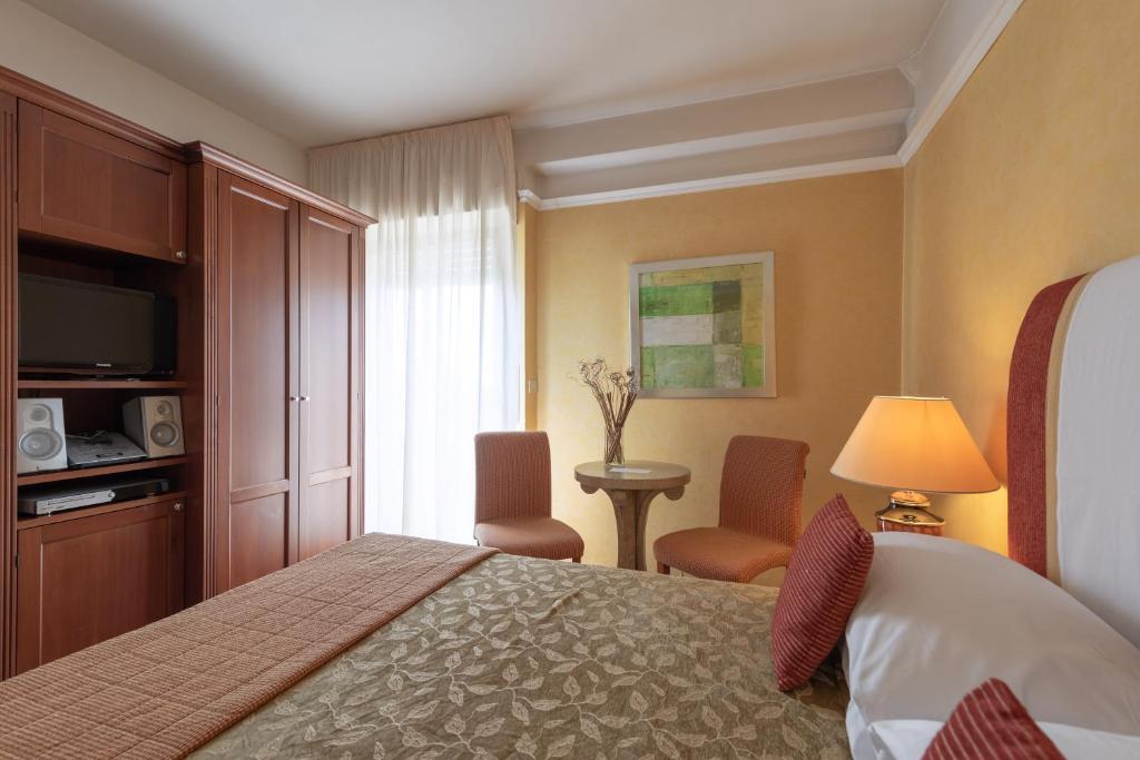 A bed or beds in a room at Bio Boutique Hotel XU' - Gruppo Ambienthotels
