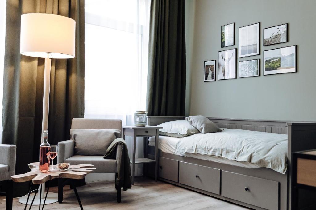 Кровать или кровати в номере Apartment an der Altstadt (#6)
