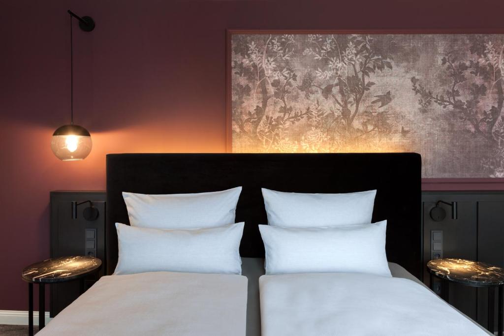 ERIKA Boutiquehotel Kitzbühelにあるベッド